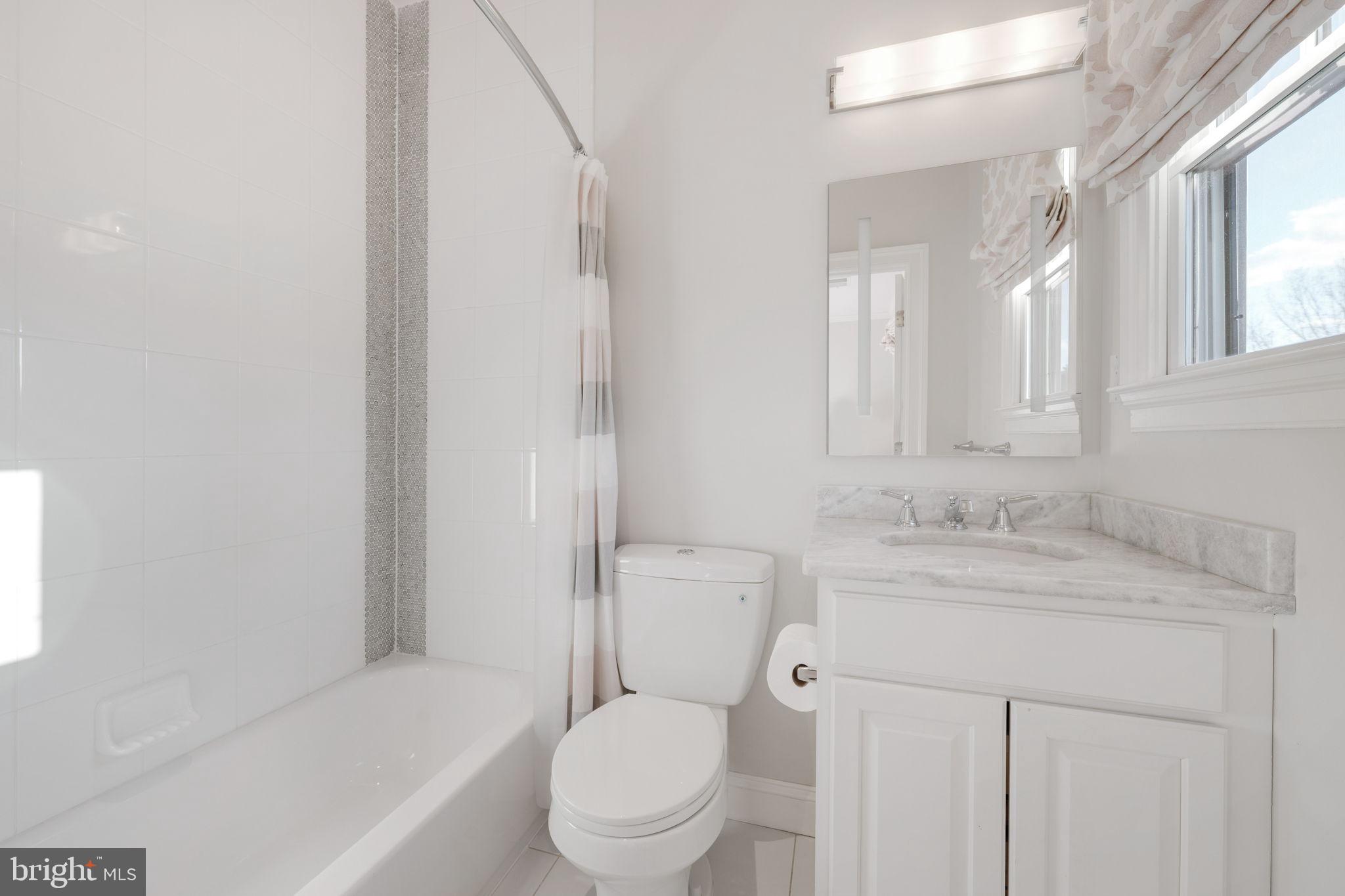 8505 Rayburn Road Bethesda, MD 20817 - Photo 35 of 49 a bathroom with a sink toilet vanity and shower