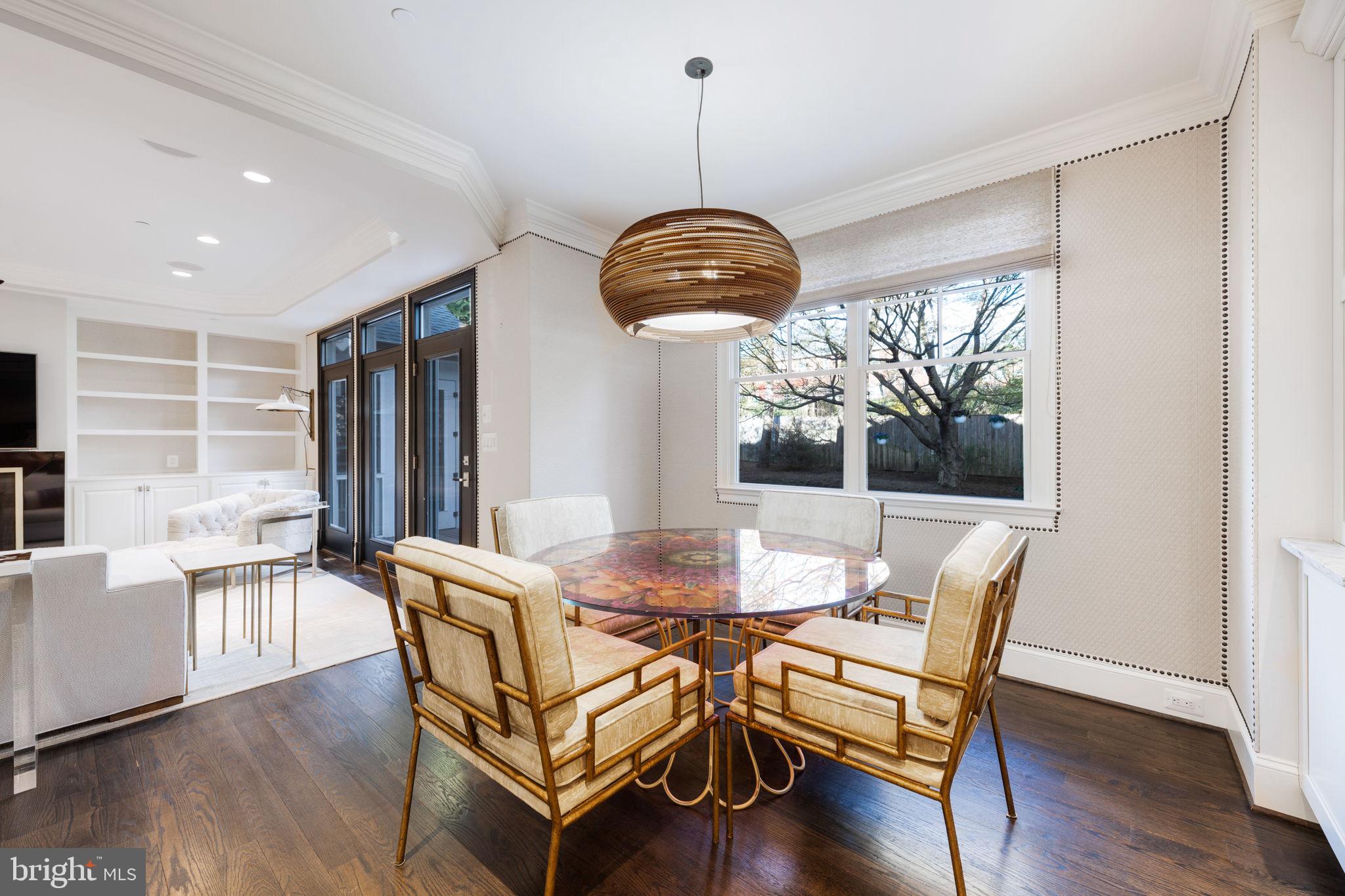 8505 Rayburn Road Bethesda, MD 20817 - Photo 6 of 49 a dining room with furniture a chandelier and wooden floor
