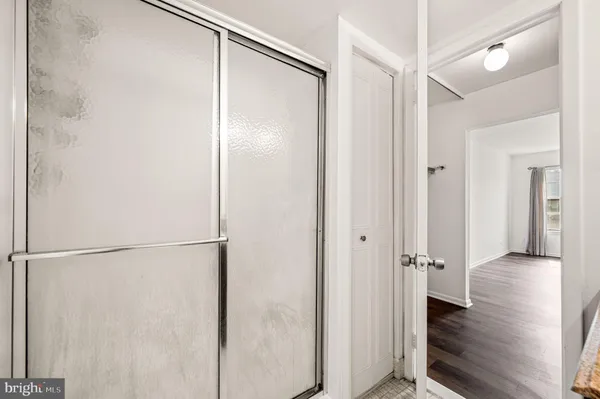 a view of a bathroom with a glass shower door