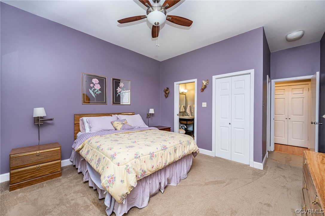 13714 Winterberry Ridge Midlothian, VA 23112 - Photo 19 of 49 a bedroom with a bed and a chandelier