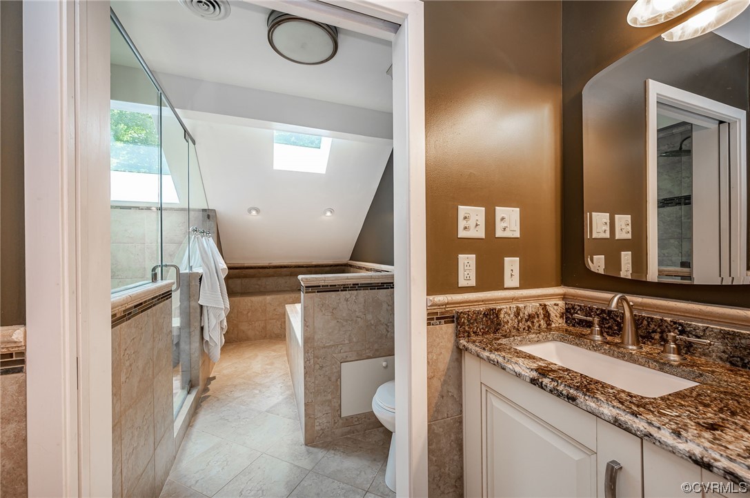 13714 Winterberry Ridge Midlothian, VA 23112 - Photo 24 of 49 a bathroom with a granite countertop sink a toilet and a mirror