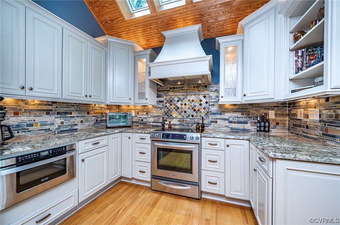 13714 Winterberry Ridge Midlothian, VA 23112 - Photo 9 of 49 a kitchen with stainless steel appliances granite countertop a stove sink and cabinets