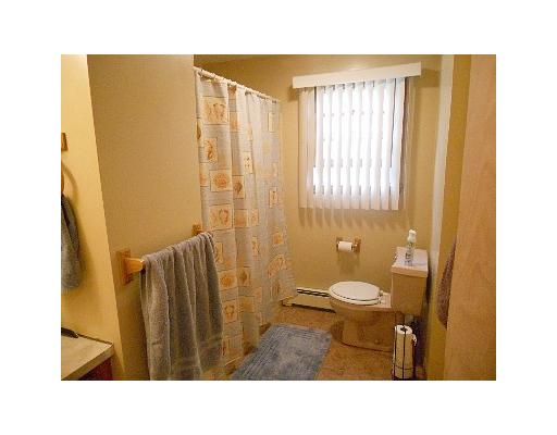 7 Parkman Road Narragansett, RI 02882 - Photo 4 of 8 Bathroom. freshly painted bathroom with matching wooden accents. also verticle blinds