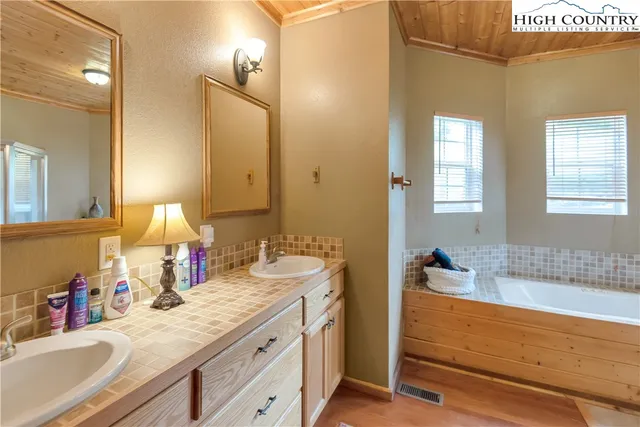 a bathroom with a bathtub and a shower