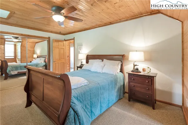 a view of a porch with furniture and wooden floor