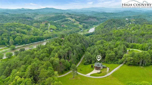 a view of a field with trees in the background