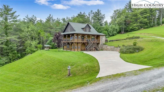 a view of a swimming pool with a yard