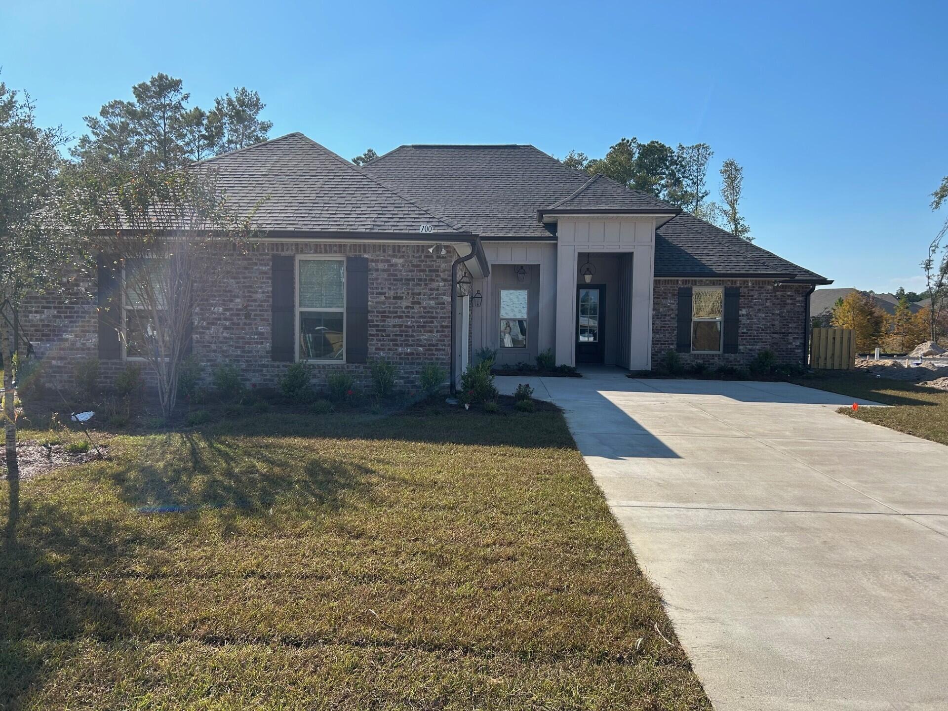 100 Lumen Loop Freeport, FL 32439 - Photo 1 of 3 a front view of a house with a yard