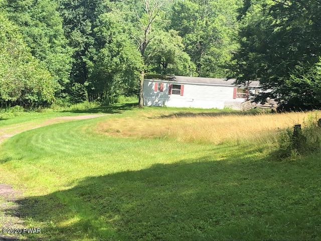 213 Slish Road Honesdale, PA 18431 - Photo 1 of 13 a view of a big yard with large trees