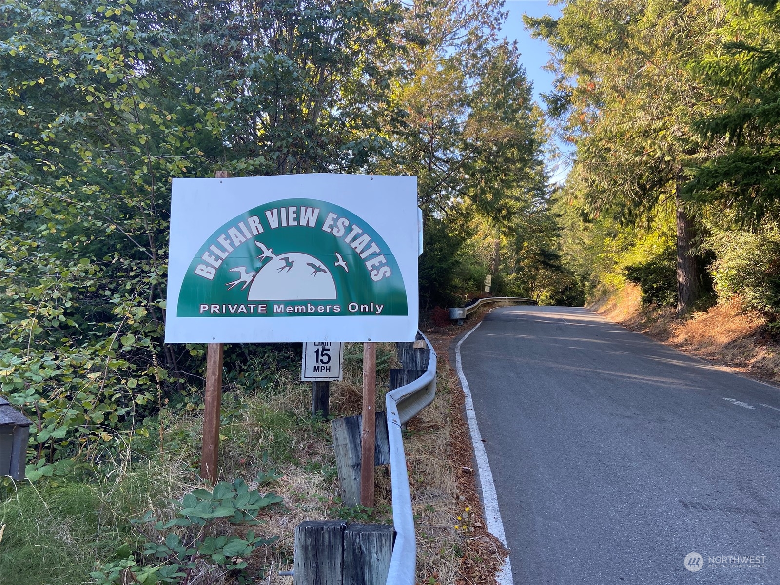 1501 Northeast Bear Ridge Road Belfair, WA 98528 - Photo 6 of 14 a sign broad on the side of the road