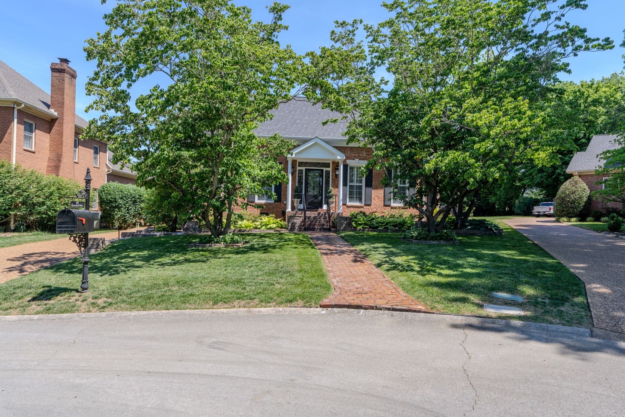 404 Chesterfield Place Franklin, TN 37064 - Photo 1 of 38 a front view of house with yard and green space