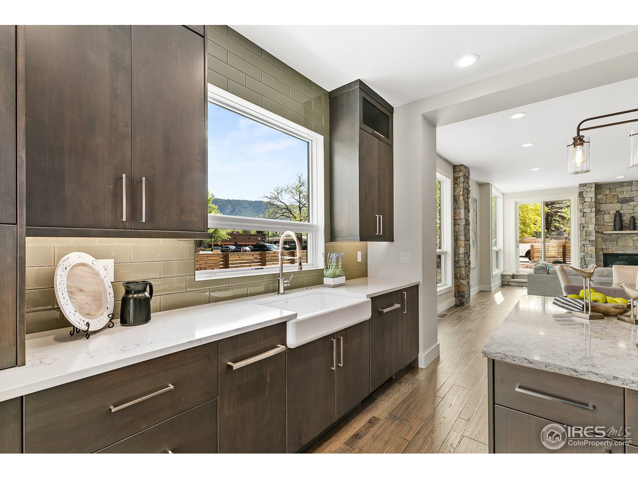 2800 10th Street Boulder, CO 80304 - Photo 13 of 40 a kitchen with sink a window and chairs