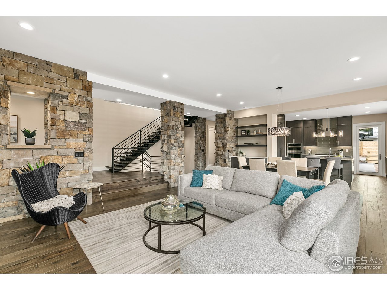 2800 10th Street Boulder, CO 80304 - Photo 16 of 40 a living room with furniture kitchen view and a wooden floor