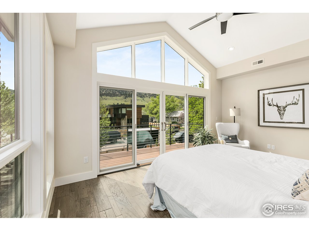 2800 10th Street Boulder, CO 80304 - Photo 26 of 40 a bedroom with a large bed and a large window