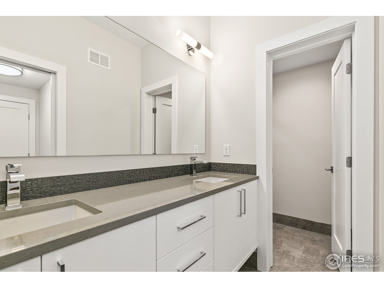 2800 10th Street Boulder, CO 80304 - Photo 37 of 40 a bathroom with a sink and a mirror