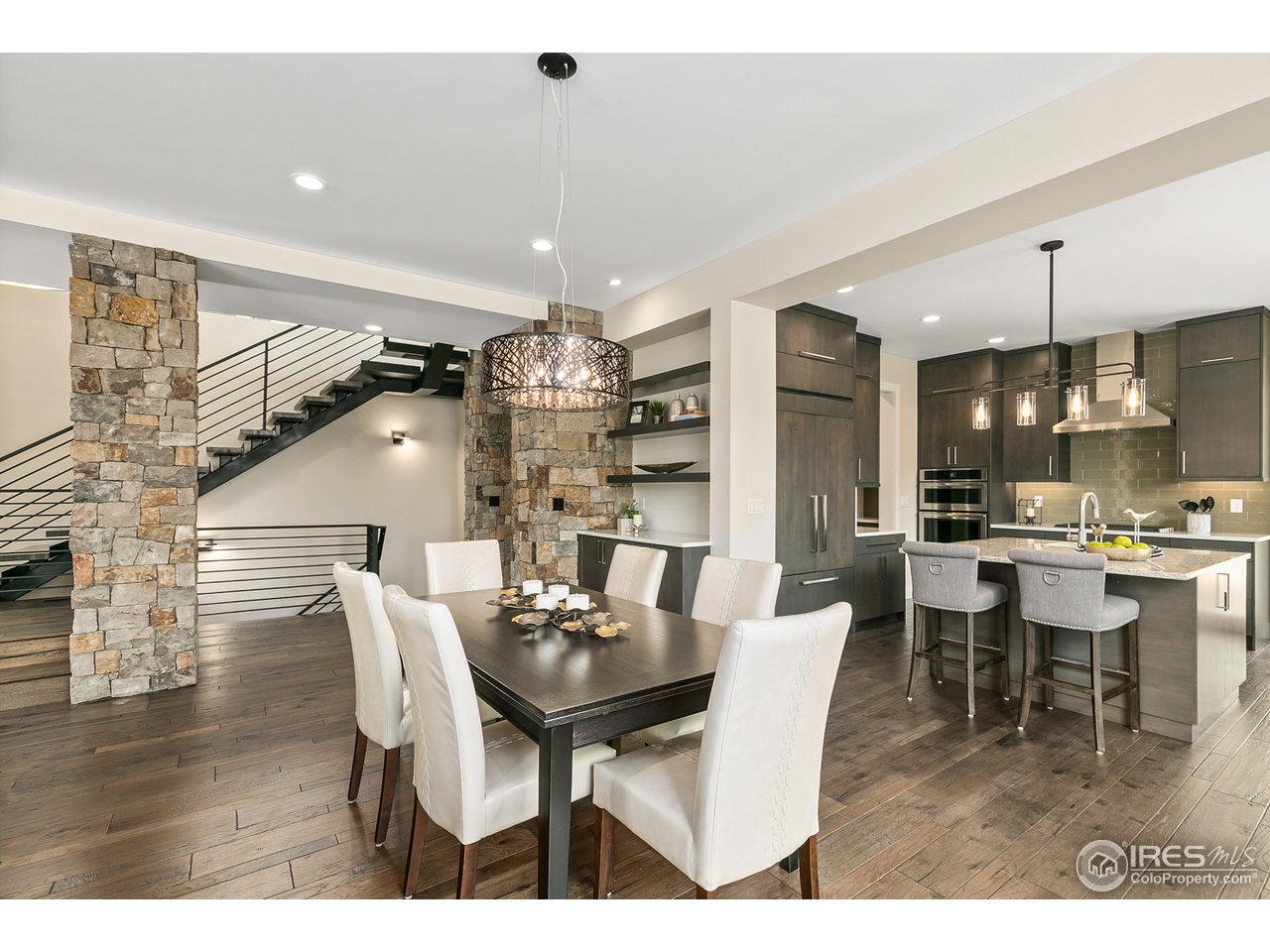 2800 10th Street Boulder, CO 80304 - Photo 7 of 40 a dining room with furniture a chandelier and wooden floor
