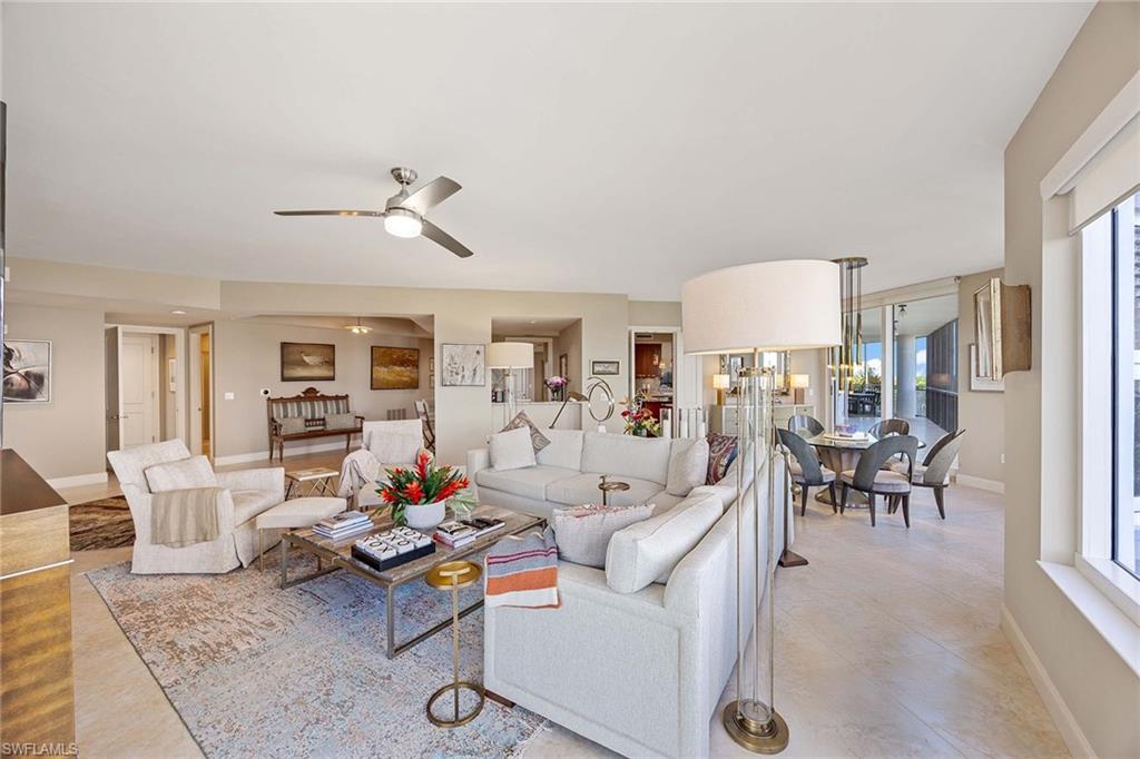13675 Vanderbilt Drive, Unit 510 Naples, FL 34110 - Photo 17 of 37 a living room with furniture and kitchen view