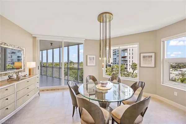 a dining room with furniture and window