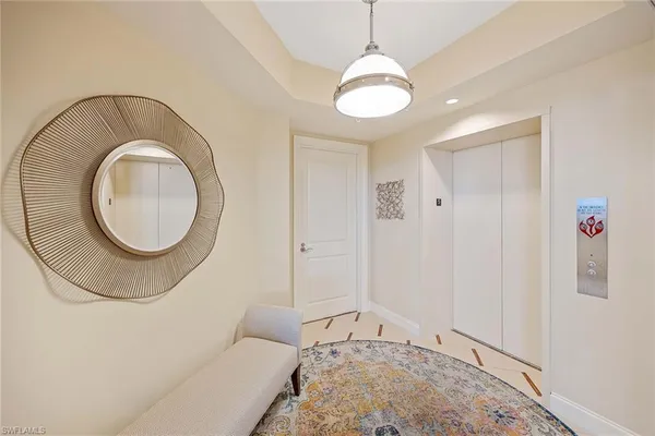 a view of a livingroom with furniture and chandelier