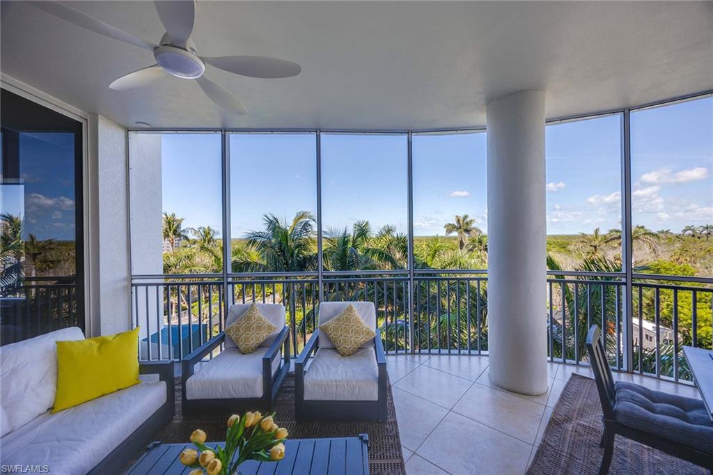 13675 Vanderbilt Drive, Unit 510 Naples, FL 34110 - Photo 35 of 37 a view of a chairs in the balcony
