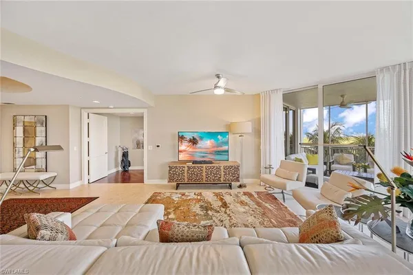 a bedroom with a large bed and a large window