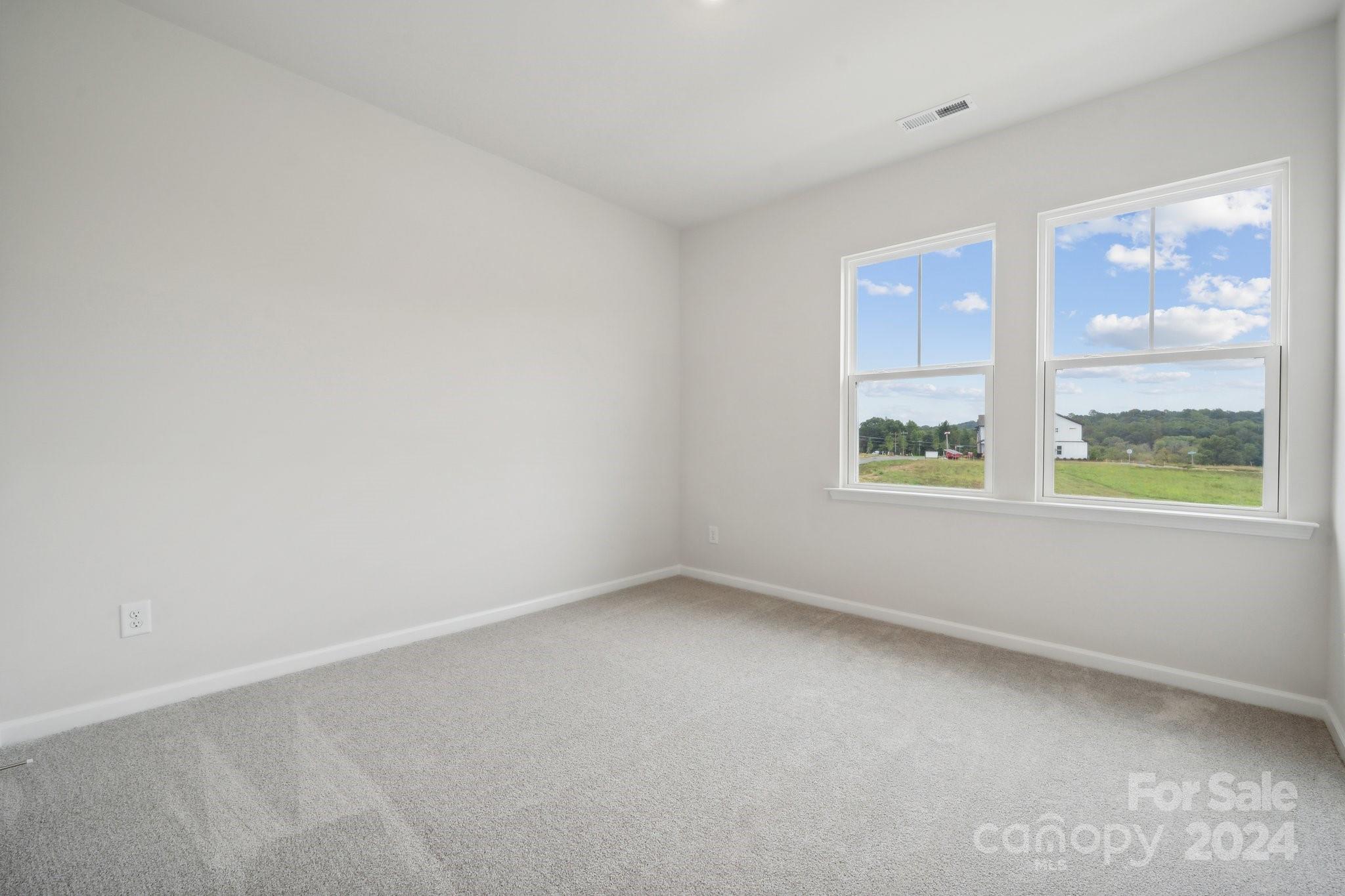 8610 Miles Gap Road Indian Land, SC 29707 - Photo 21 of 26 an empty room with windows