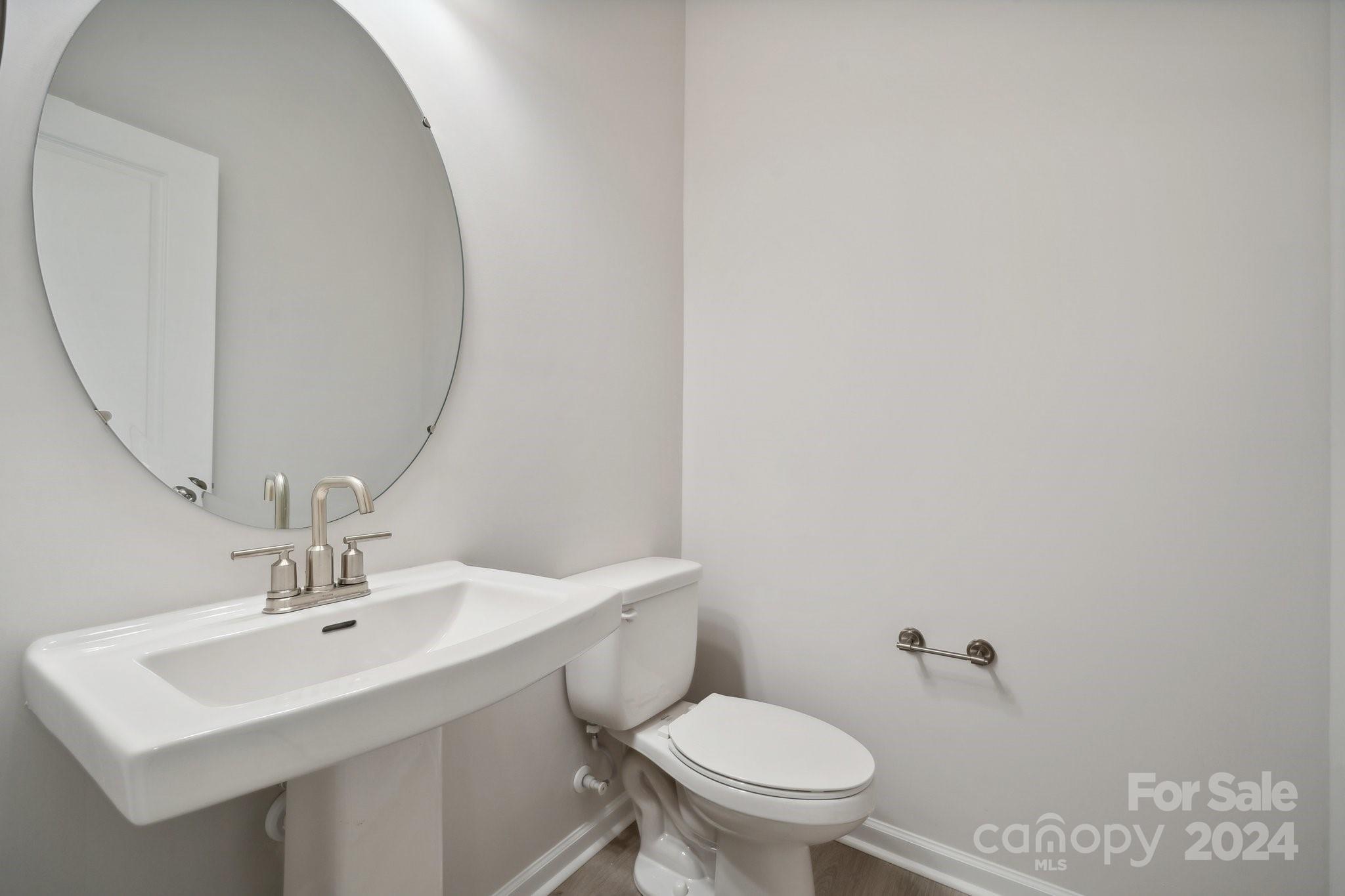 8610 Miles Gap Road Indian Land, SC 29707 - Photo 23 of 26 a bathroom with a sink toilet and a mirror