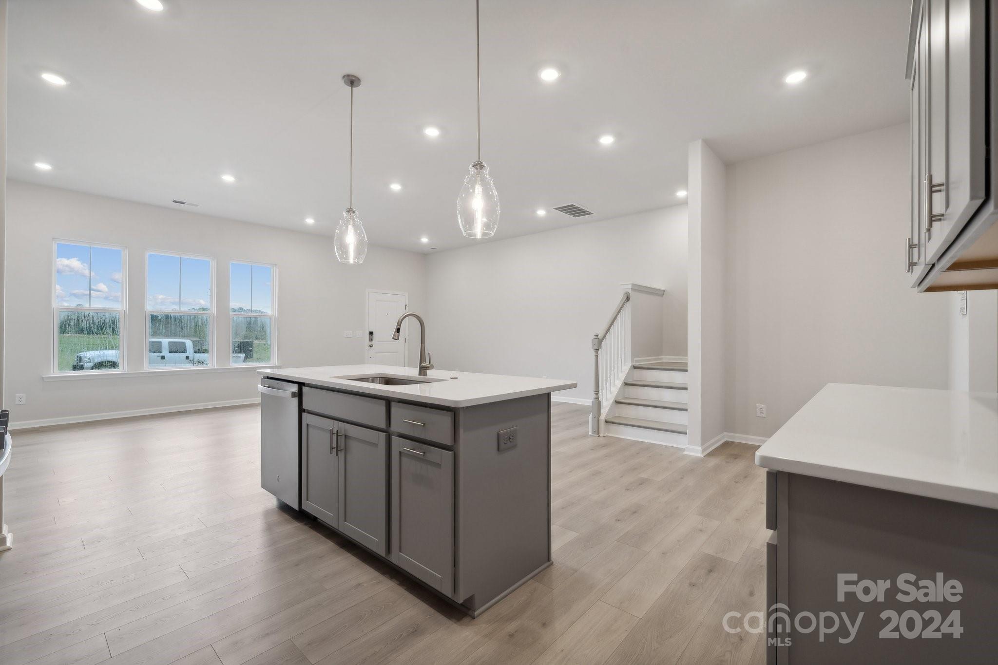 8610 Miles Gap Road Indian Land, SC 29707 - Photo 6 of 26 a kitchen with kitchen island a sink appliances and a counter top space
