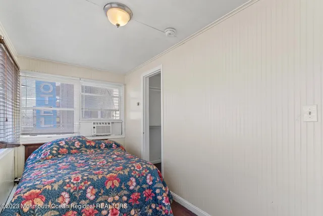 a bedroom with a bed and a cabinets