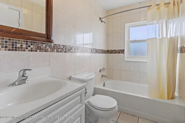 a bedroom with a bed and utility room