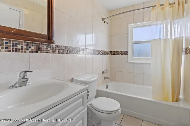 a bedroom with a bed and utility room