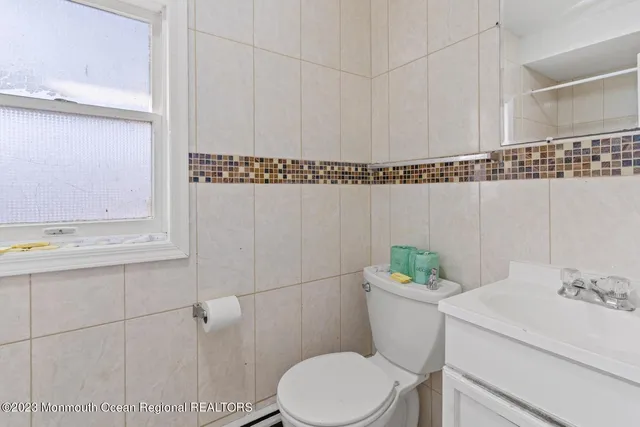 a living room with furniture rug and a window