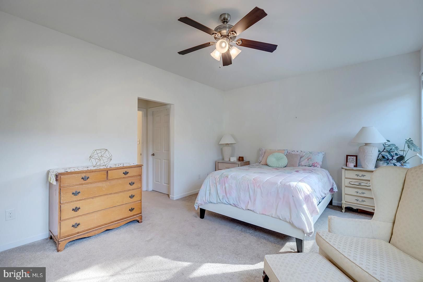 117 Carriage Drive Milton, DE 19968 - Photo 18 of 62 a bedroom with a bed and a ceiling fan