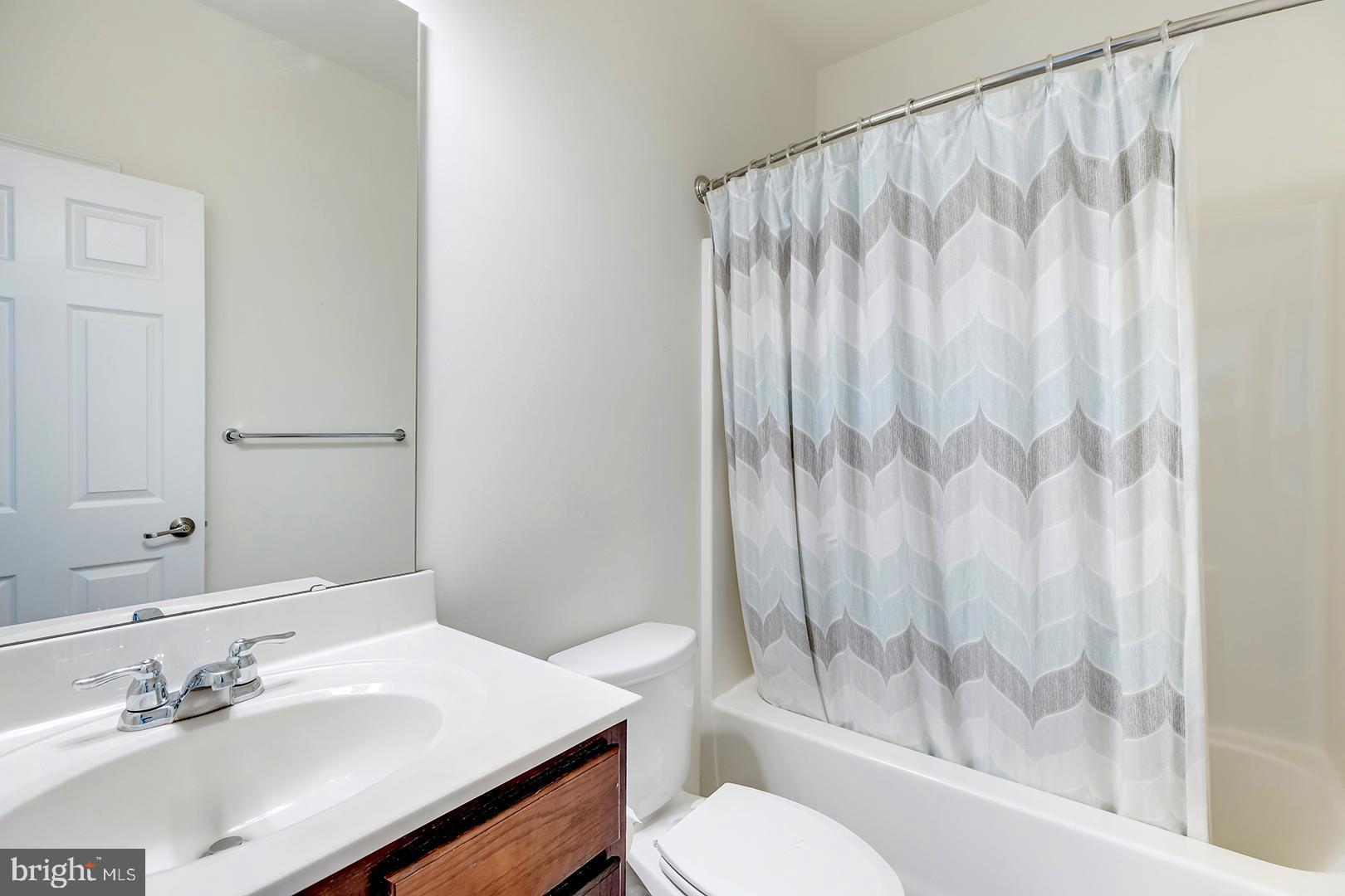 117 Carriage Drive Milton, DE 19968 - Photo 24 of 62 a bathroom with a sink a toilet and shower