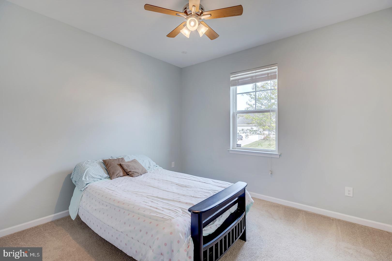 117 Carriage Drive Milton, DE 19968 - Photo 25 of 62 a bedroom with a bed and a window
