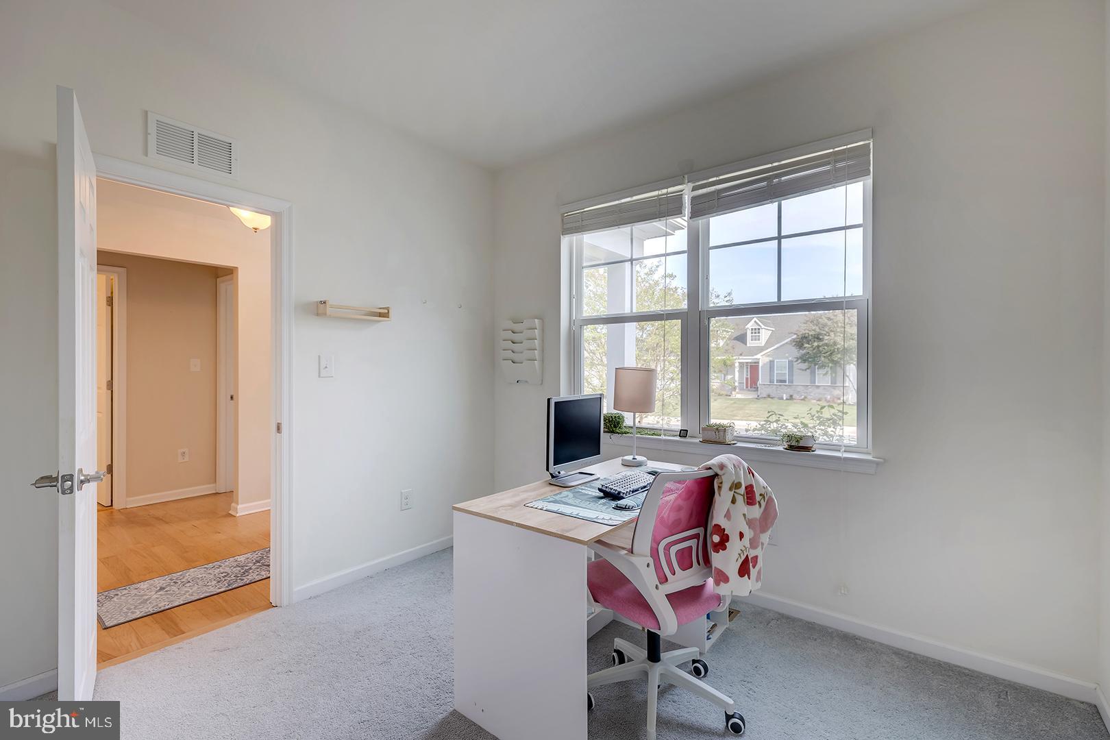 117 Carriage Drive Milton, DE 19968 - Photo 29 of 62 a view of a workspace with furniture and a window