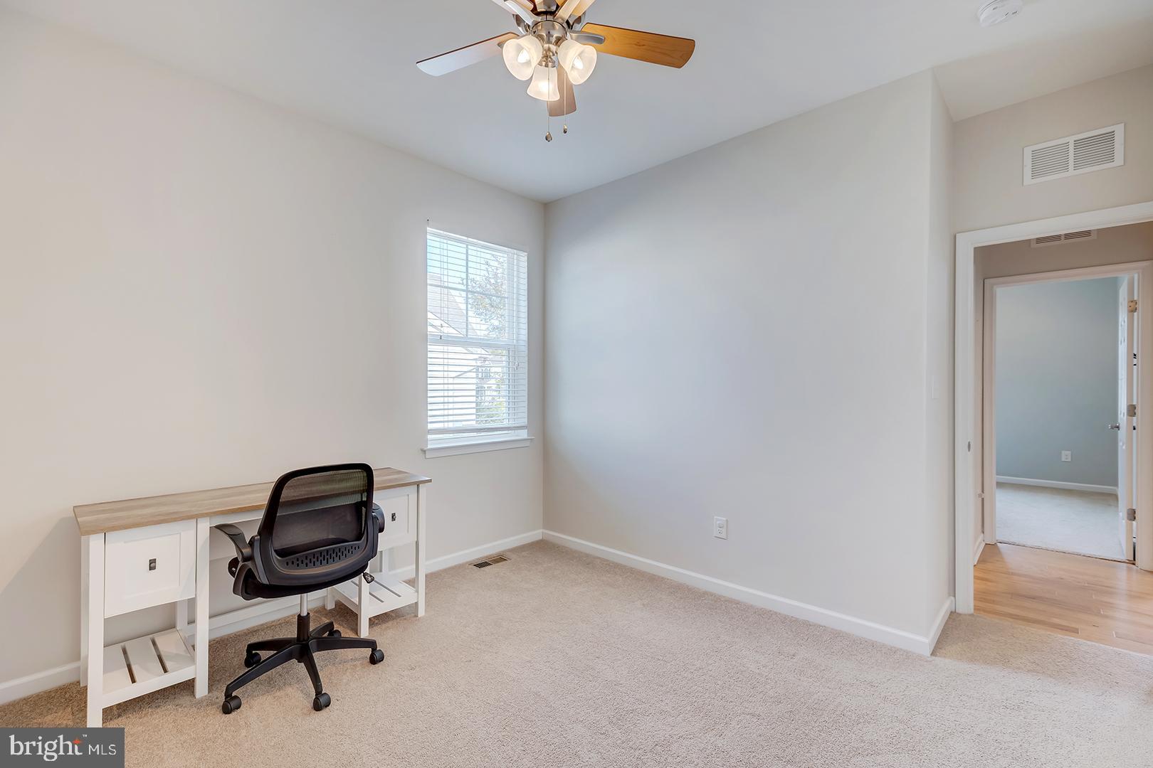117 Carriage Drive Milton, DE 19968 - Photo 30 of 62 a view of a workspace with furniture and a window