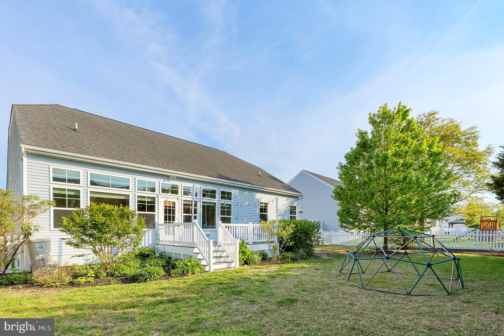 117 Carriage Drive Milton, DE 19968 - Photo 36 of 62 a front view of house with a garden and patio
