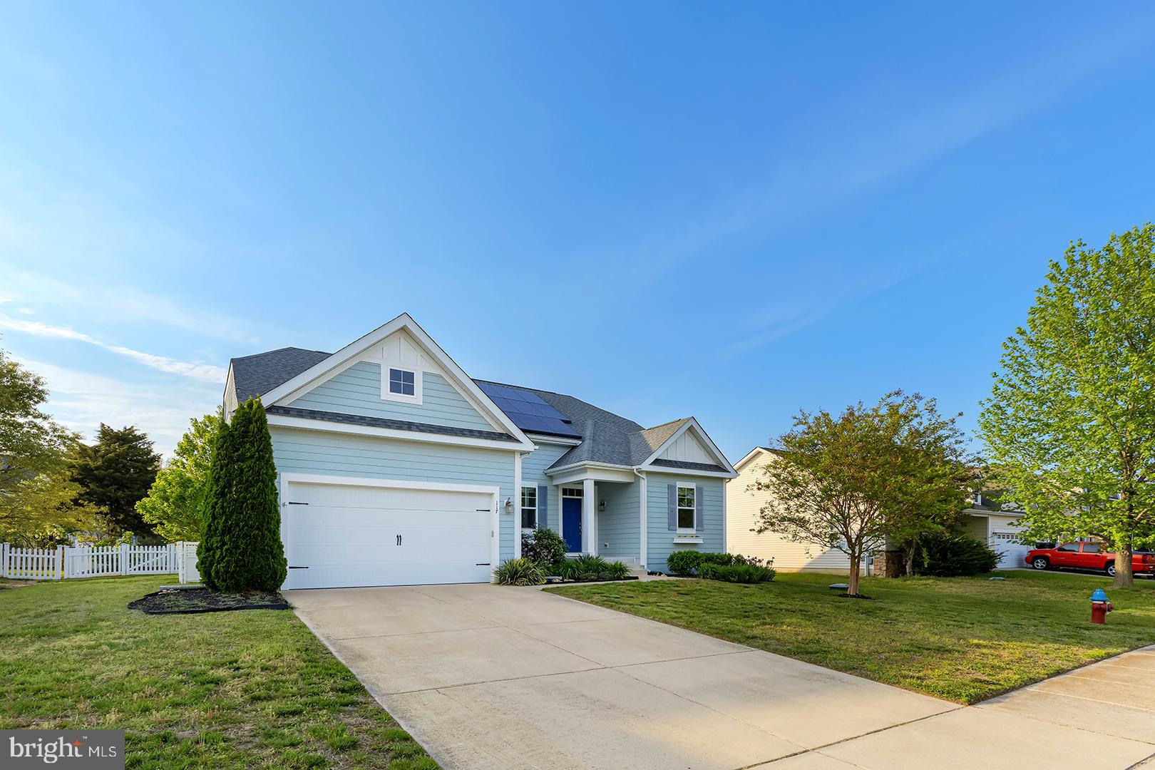 117 Carriage Drive Milton, DE 19968 - Photo 43 of 62 a front view of a house with a yard