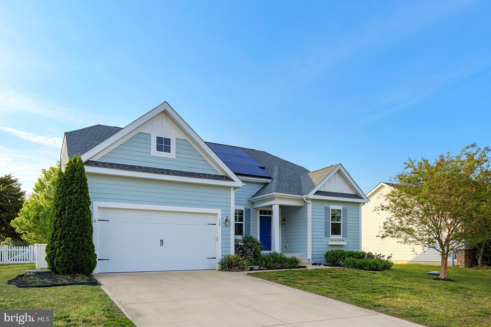 117 Carriage Drive Milton, DE 19968 - Photo 44 of 62 a front view of a house with a yard