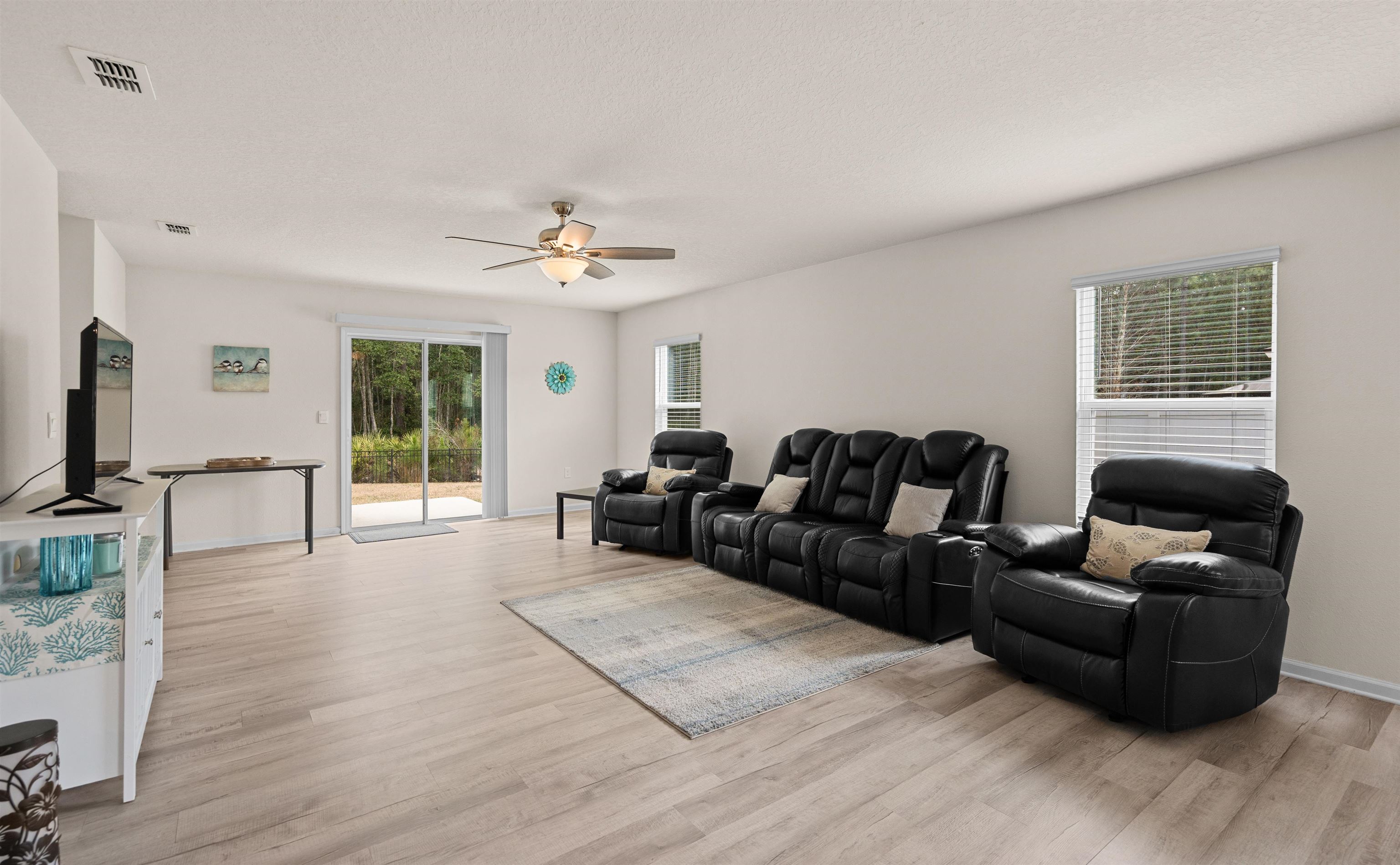 154 Falcon Ridge Road St. Augustine, FL 32084 - Photo 10 of 38 a living room with furniture and a window