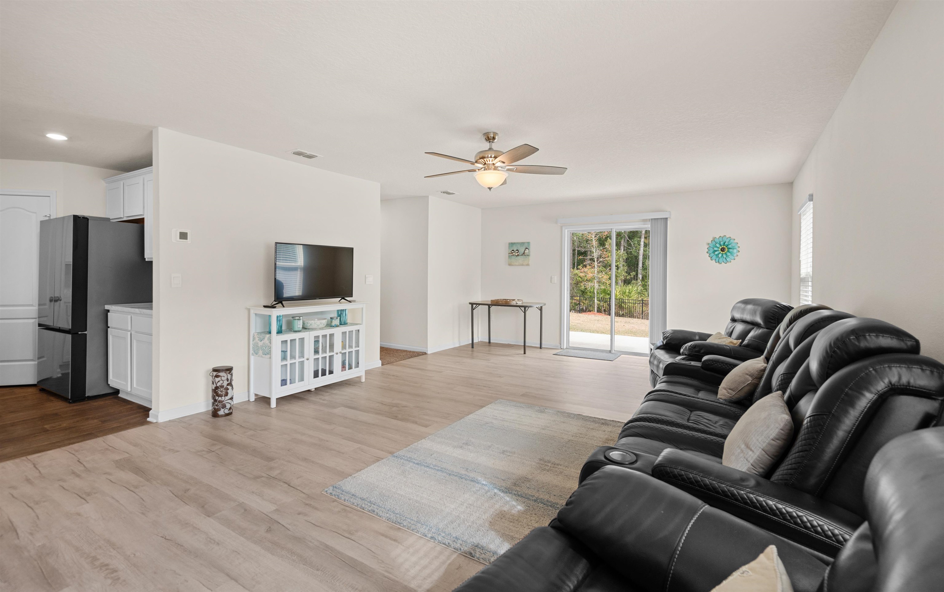 154 Falcon Ridge Road St. Augustine, FL 32084 - Photo 13 of 38 a living room with furniture and a flat screen tv