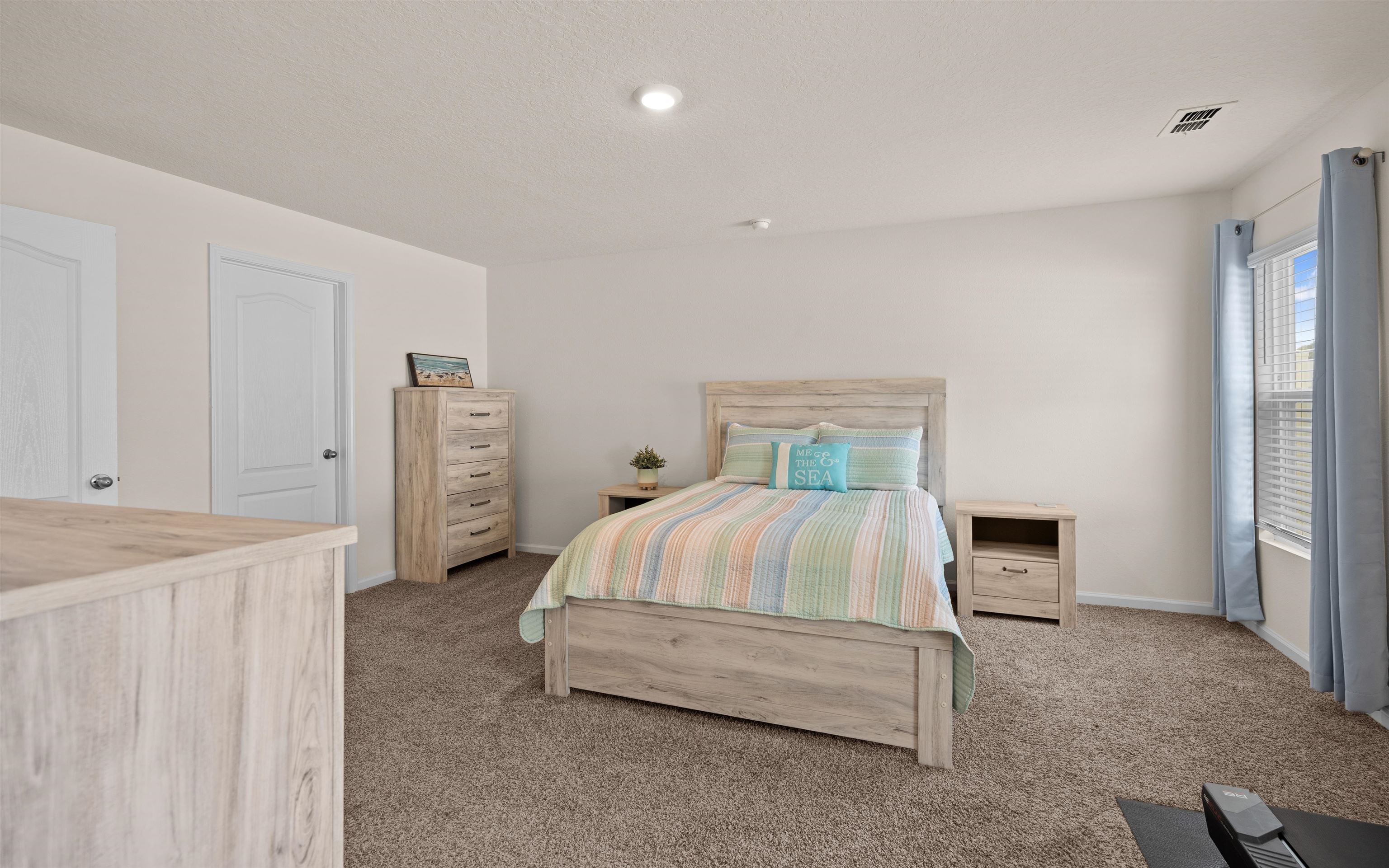 154 Falcon Ridge Road St. Augustine, FL 32084 - Photo 16 of 38 a bedroom with a bed and a fireplace