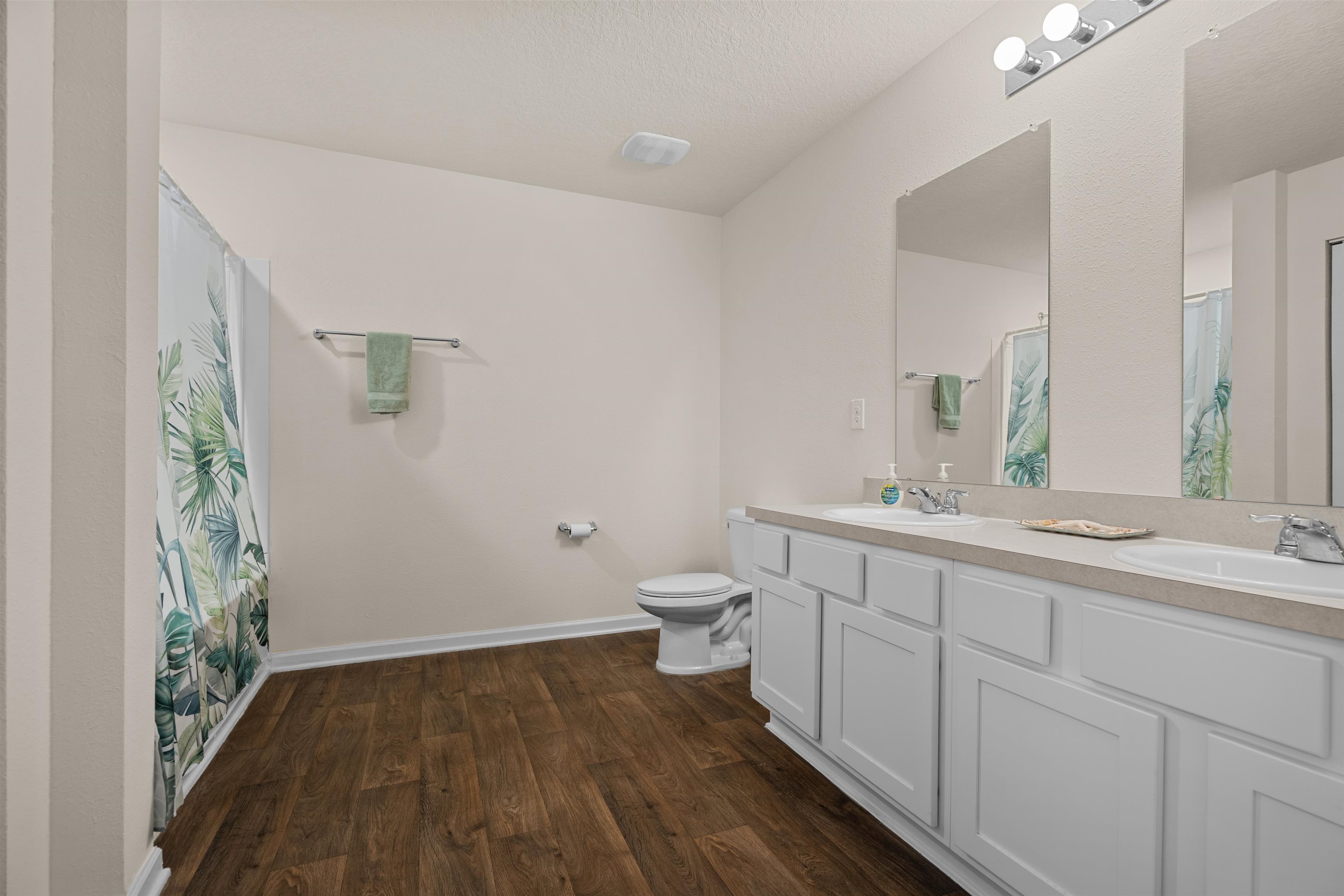 154 Falcon Ridge Road St. Augustine, FL 32084 - Photo 17 of 38 a bathroom with a granite countertop sink toilet and a large mirror