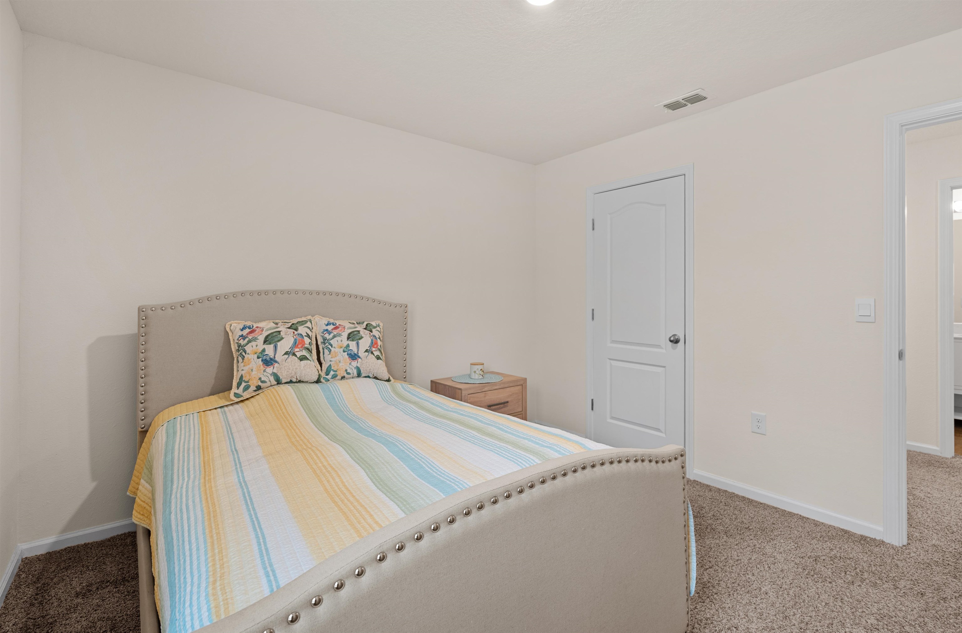 154 Falcon Ridge Road St. Augustine, FL 32084 - Photo 20 of 38 a bedroom with a bed and a window
