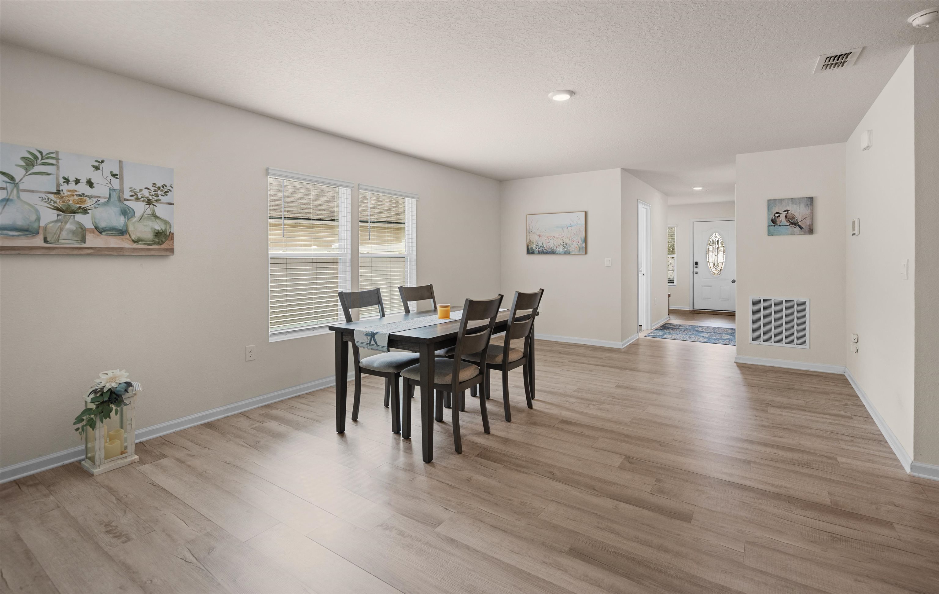 154 Falcon Ridge Road St. Augustine, FL 32084 - Photo 6 of 38 a view of a dining room with furniture and wooden floor
