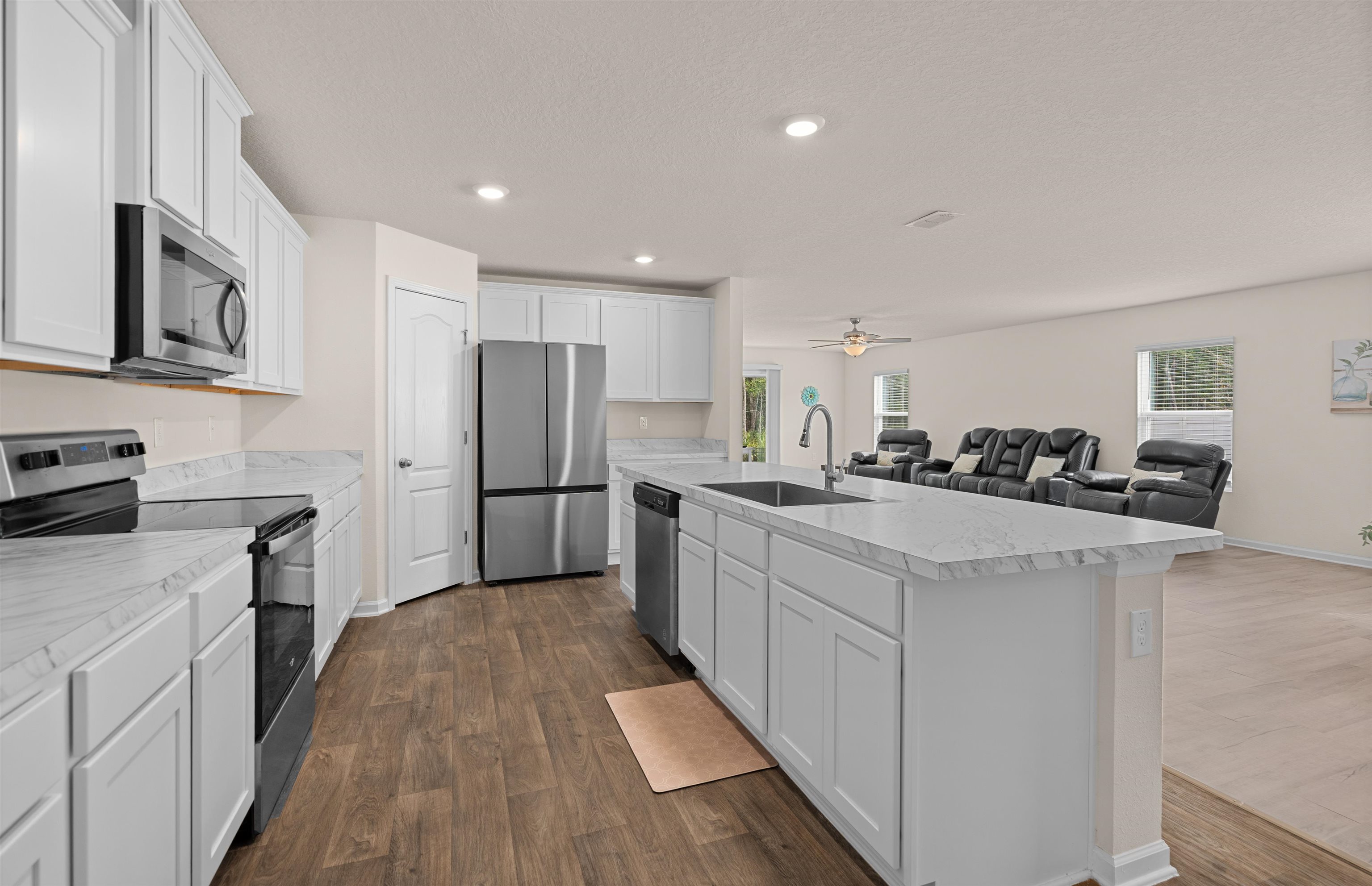154 Falcon Ridge Road St. Augustine, FL 32084 - Photo 38 of 38 a kitchen with stainless steel appliances a refrigerator sink and stove