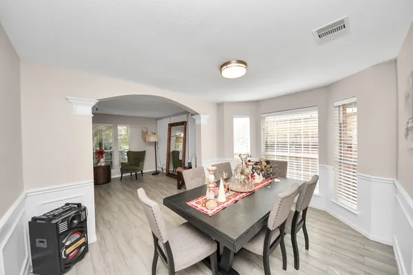 a dining room with furniture and window