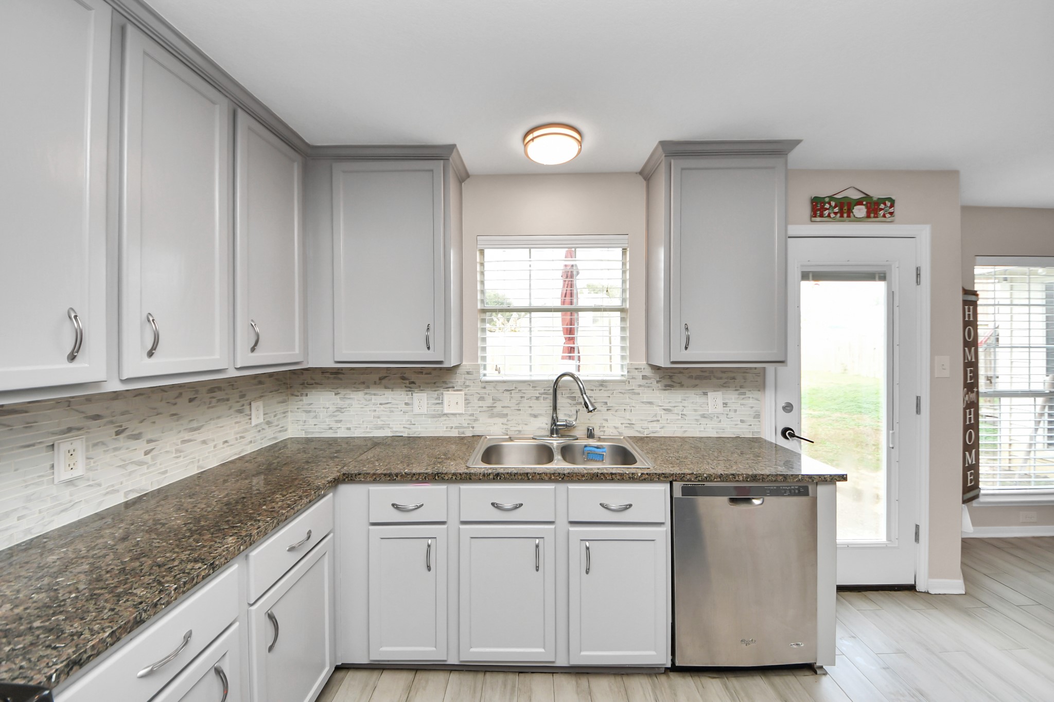 515 Spindle Ridge Drive Spring, TX 77386 - Photo 25 of 47 a kitchen with granite countertop a sink cabinets and window