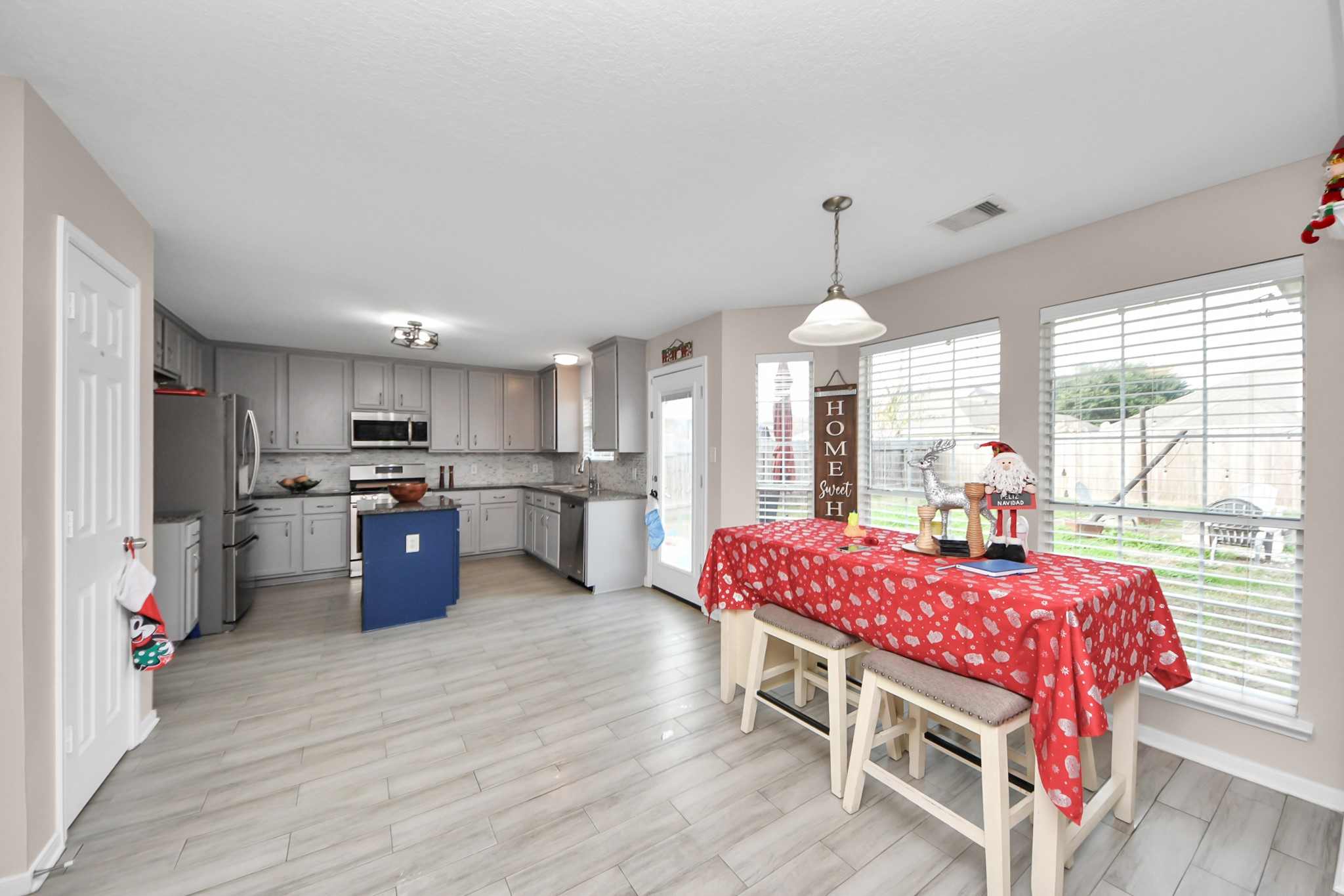 515 Spindle Ridge Drive Spring, TX 77386 - Photo 27 of 47 a dining room with furniture window and wooden floor